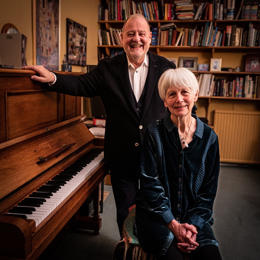 Philip Contini standing at the piano with Anne Evans seated — Appassionato