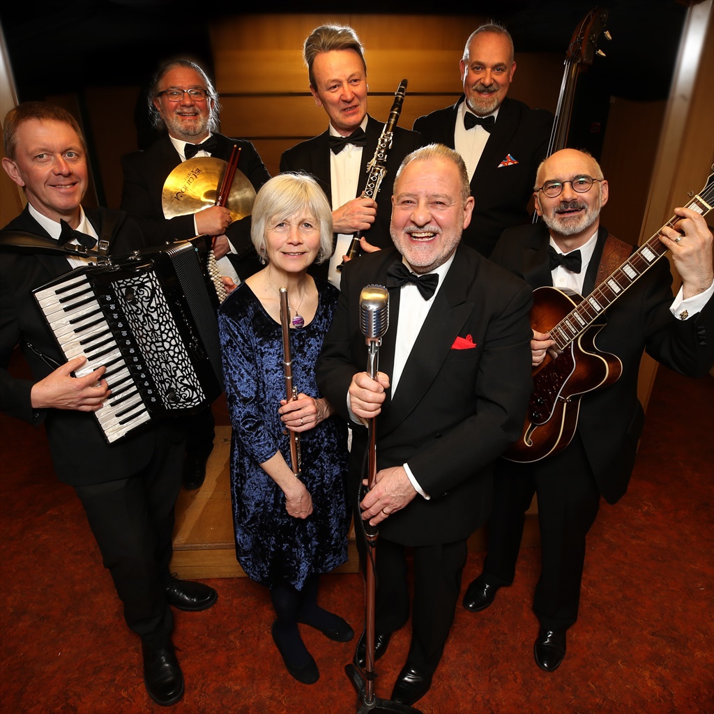Philip Contini & His Be Happy Band, in black tie with accordion, clarinet and guitar